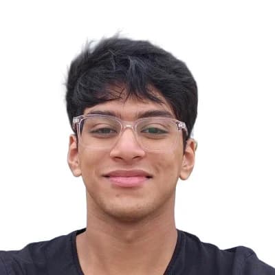 Agnay Srivastava smiling against a light background